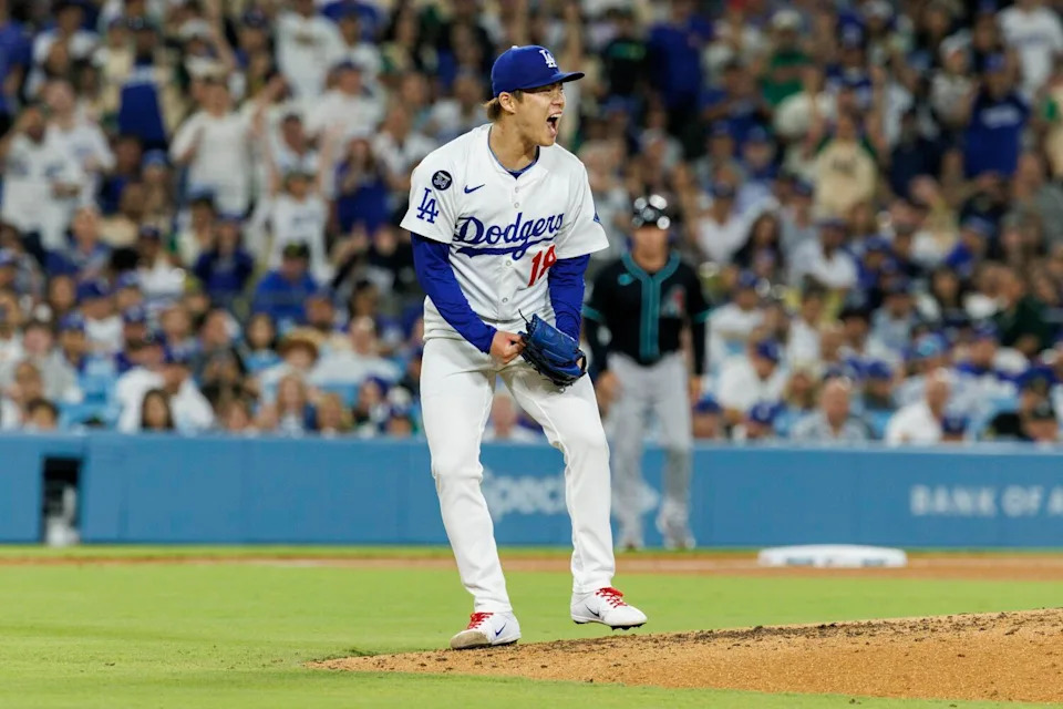 Yoshinobu Yamamoto reacts after striking out Arizona's Pavin Smith to retire end the seventh inning.