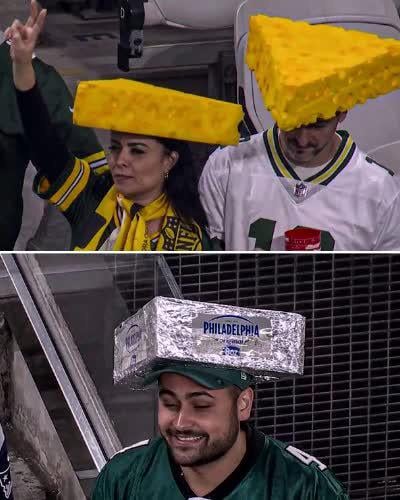When cheeseheads clash with cream cheese bricks—NFL fandom just got a whole lot tastier. 🧀🧱💚