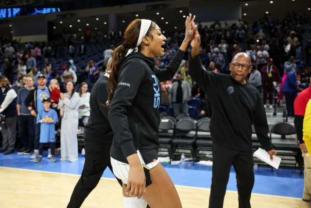Angel Reese celebrates after the Sky defeated the Lynx 74-69 in a preseason game at Wintrust Arena on May 6, 2025. (Armando L. Sanchez/Chicago Tribune)