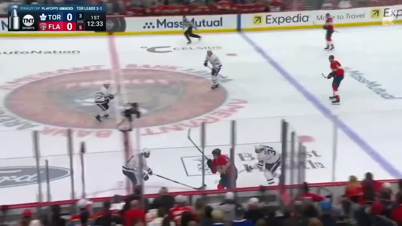 Marchand cross checks Leafs player from behind while leaving his feet. No call on the play.