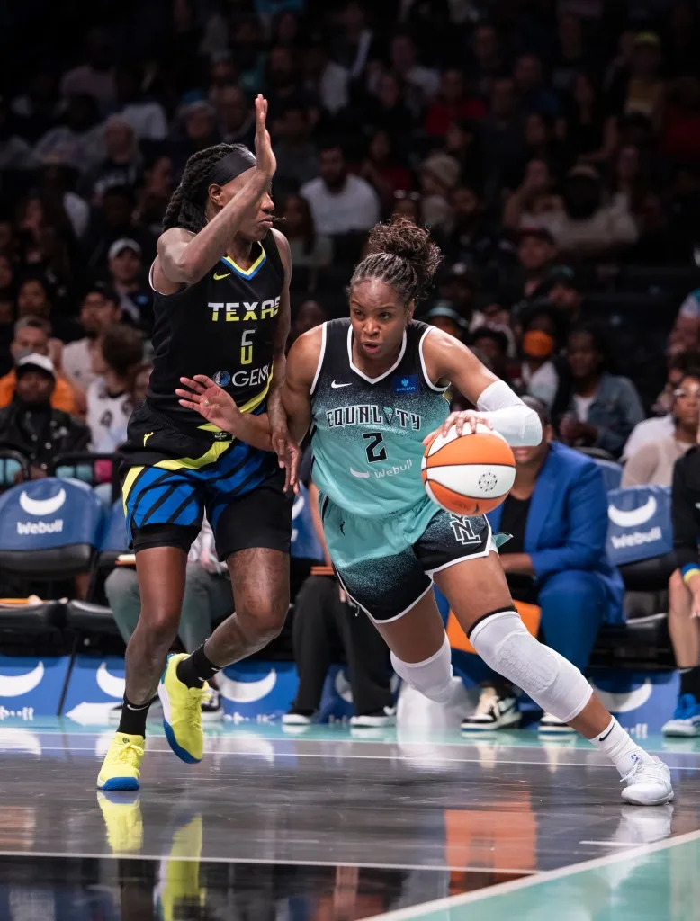 The Liberty’s Kennedy Burke drives on the Wings’ Natasha Howard during <br>a regular season matchup at Barclays Center . <br> Michelle Farsi/New York Post