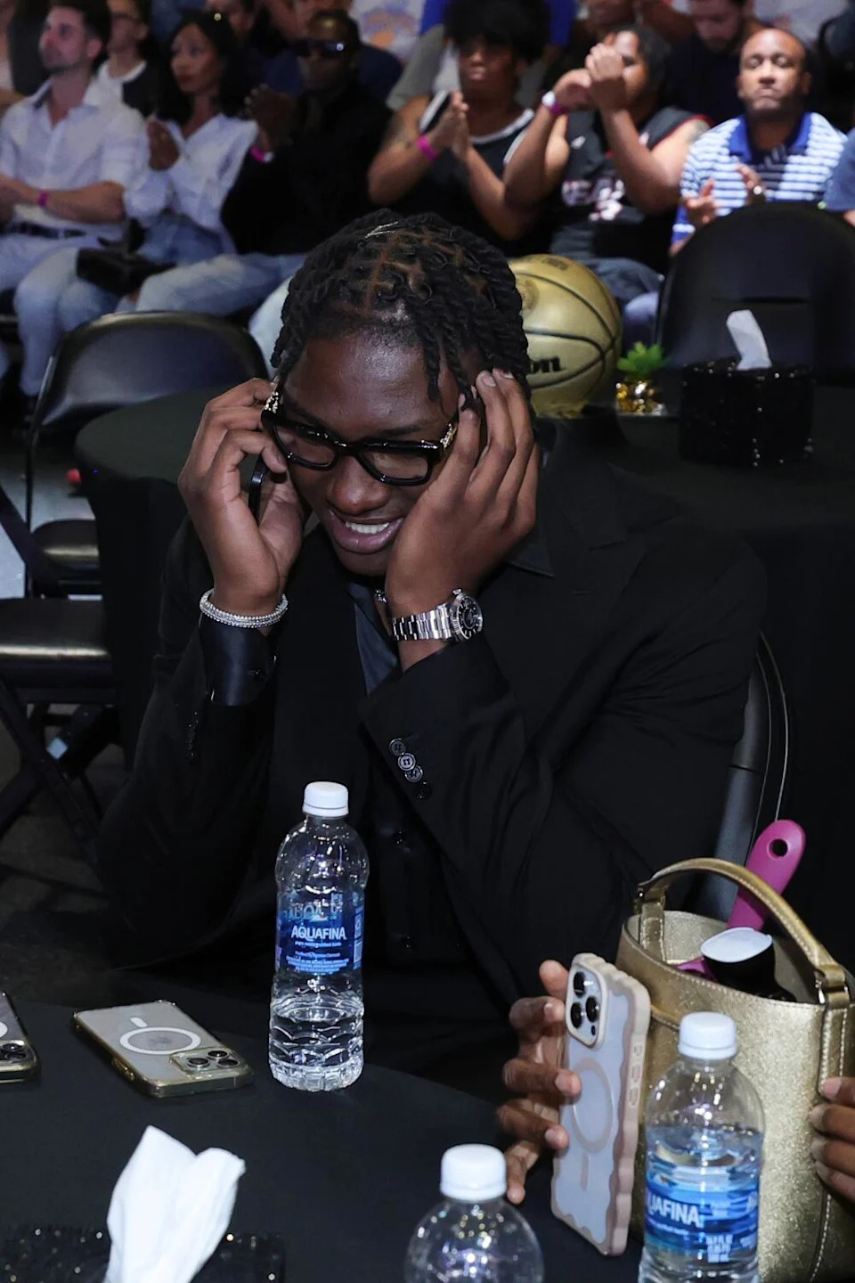 Adou Thiero speaks on the phone after being acquired by the Lakers at the NBA draft on Thursday.