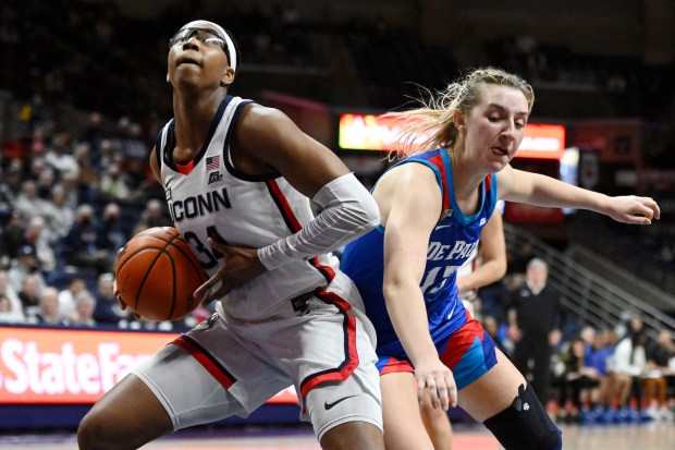 UConn's Ayanna Patterson, left, looks to shoot as DePaul's Maeve McErlane defends in the second half of an NCAA college basketball game, Monday, Jan. 23, 2023, in Storrs, Conn. (AP Photo/Jessica Hill)