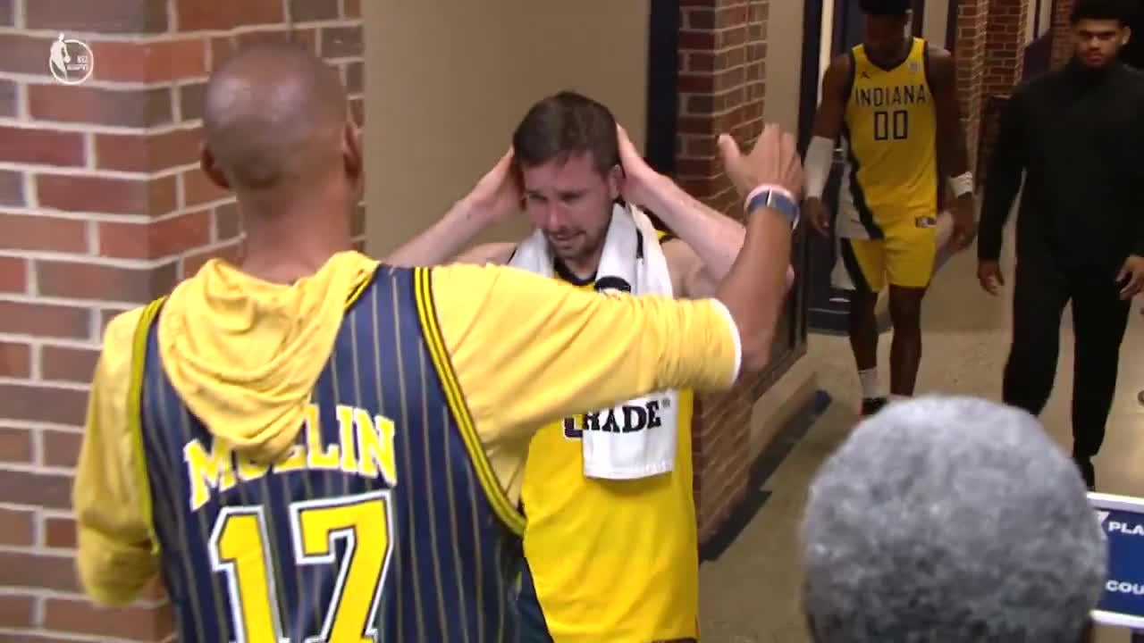 Reggie Miller hugs a crying T.J. McConnell in the tunnel. Left it all out there.