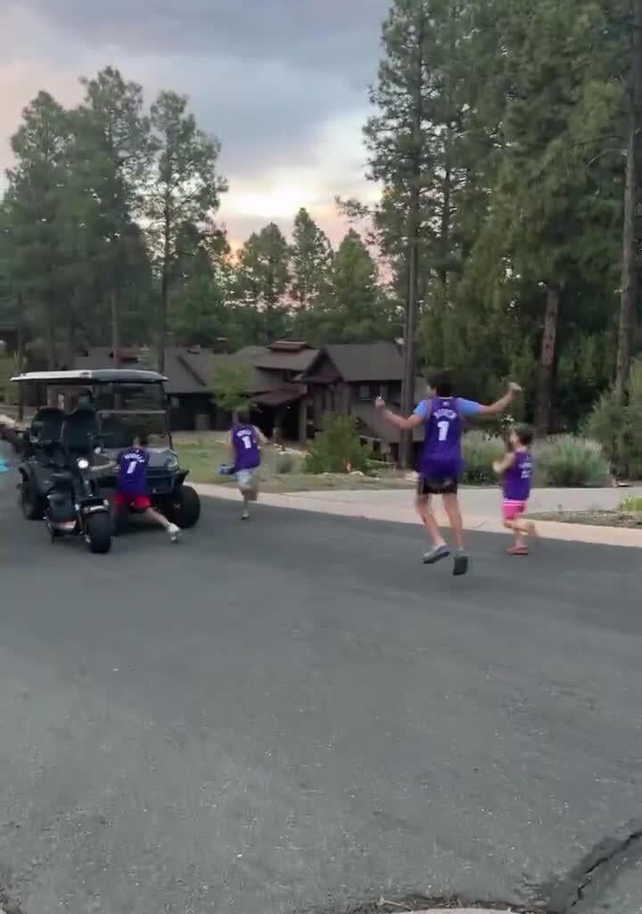 Devin Booker was golfing when he ran into some kids wearing his jerseys. He stopped by to talk to everyone and signed their jerseys.
