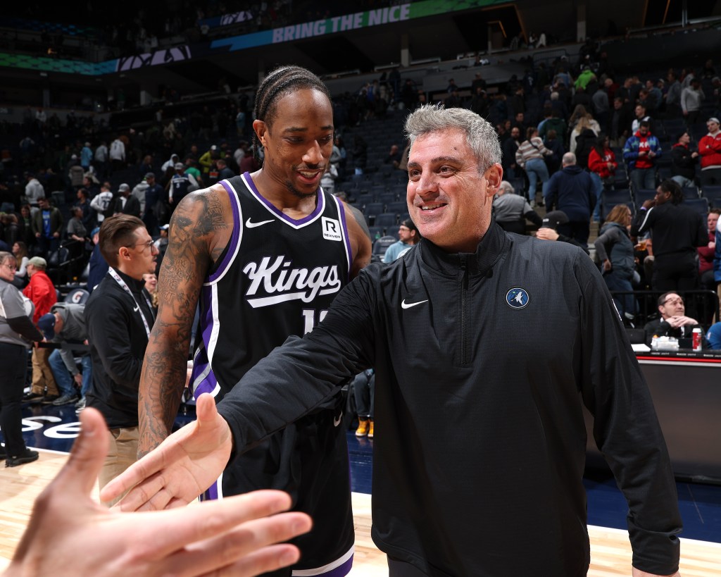 DeMar DeRozan #10 of the Sacramento Kings and Assistant Coach Micah Nori of the Minnesota Timberwolves smile after the game on February 3, 2025.