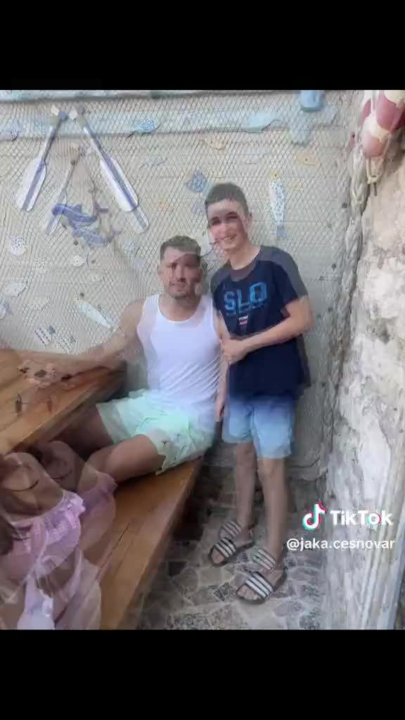 A visibly skinny Luka Doncic poses for a pic with a fan