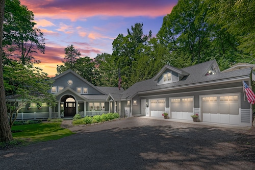 Lush golf course in your backyard in true northern Michigan? This nearly $3.5M luxury home has it all.