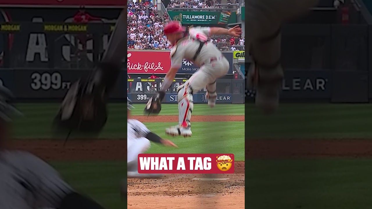 J.T. Realmuto applies the mid-air tag at home! 🤯