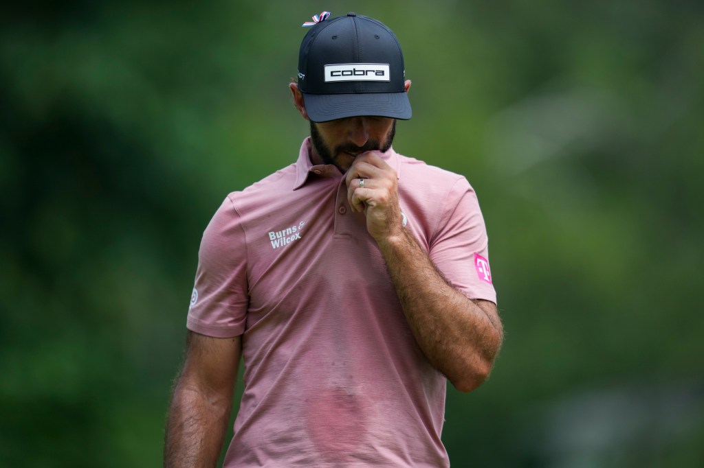 Max Homa walks on the eighth green during the second round of the Rocket Mortgage Classic golf tournament. 
