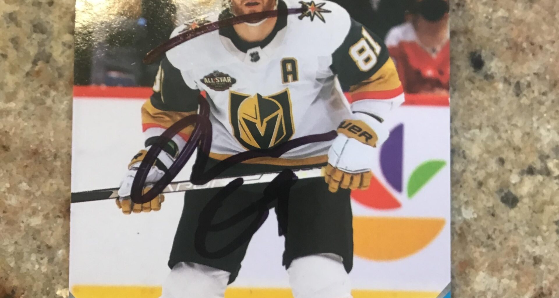 Got this in a shoebox full of cards at the thrift store, looks a little off, is it real?