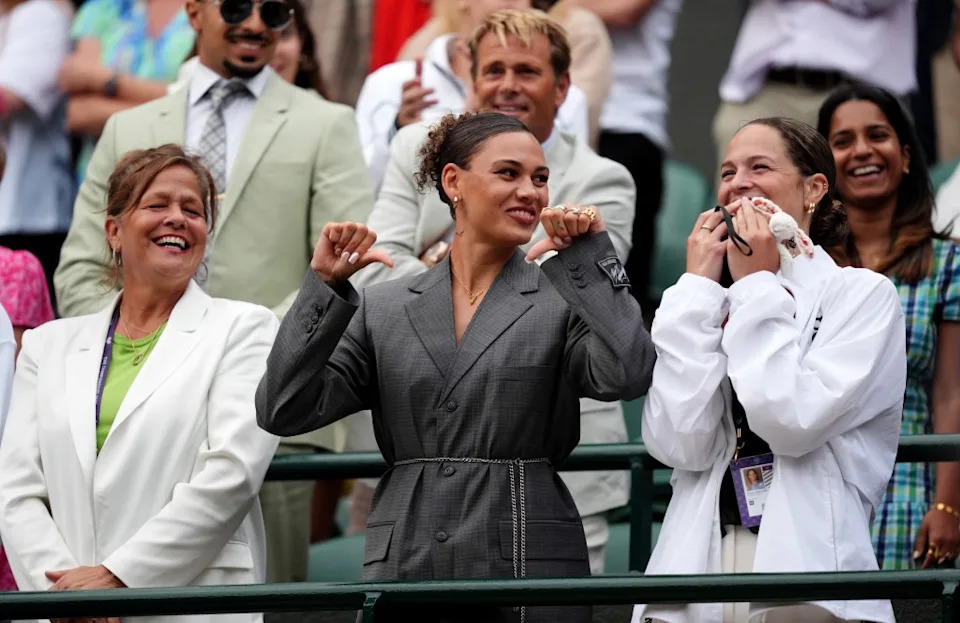 (L-R) Ben Shelton’s mom Lisa, his girlfriend Trinity Rodman girlfriend and his sister Emma react to him telling the Wimbledon crowd that Emma needs more days off from work to stay at the tournament in London. PA Images via Getty Images