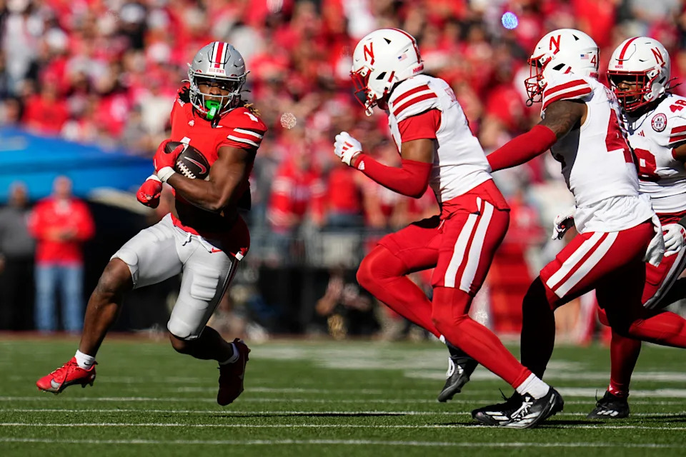 Ohio State Buckeyes running back Quinshon Judkins (1) runs around Nebraska Cornhuskers defensive back DeShon Singleton (8) during the second half of the NCAA football game at Ohio Stadium in Columbus on Saturday, Oct. 26, 2024. Ohio State won 21-17.
