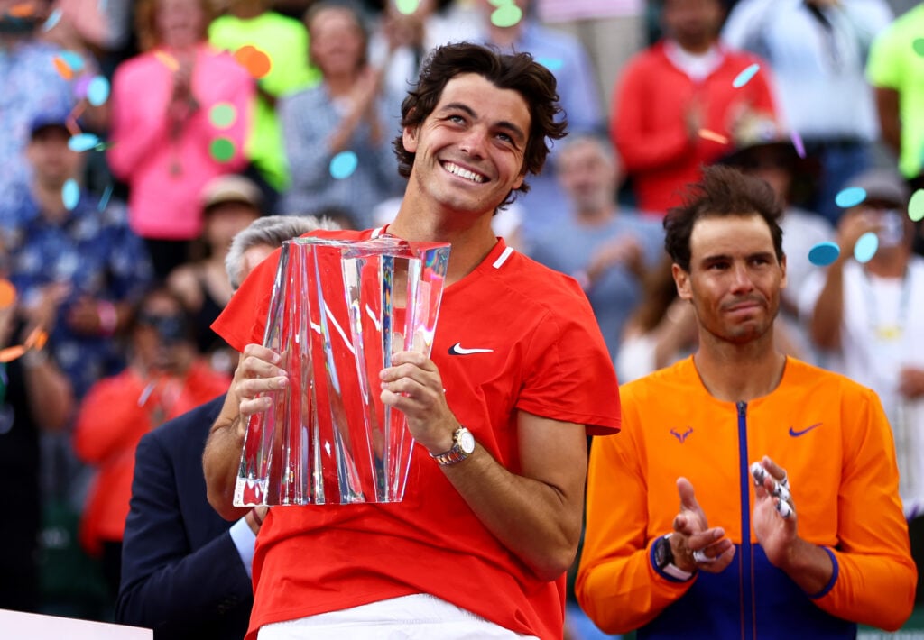 Taylor Fritz of the United States holds his winners trophy after his straight sets victory against Rafael Nadal of Spain in the men's Final on Day 14 of the BNP Paribas Open at Indian Wells.