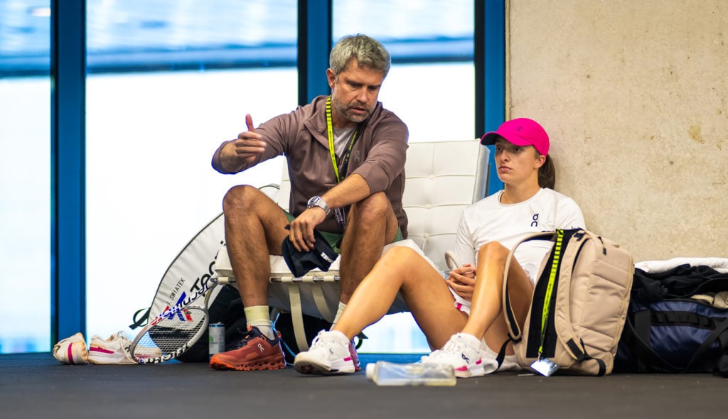 Tomasz Wiktorowski and Iga Swiatek sit down together at the 2024 Madrid Open