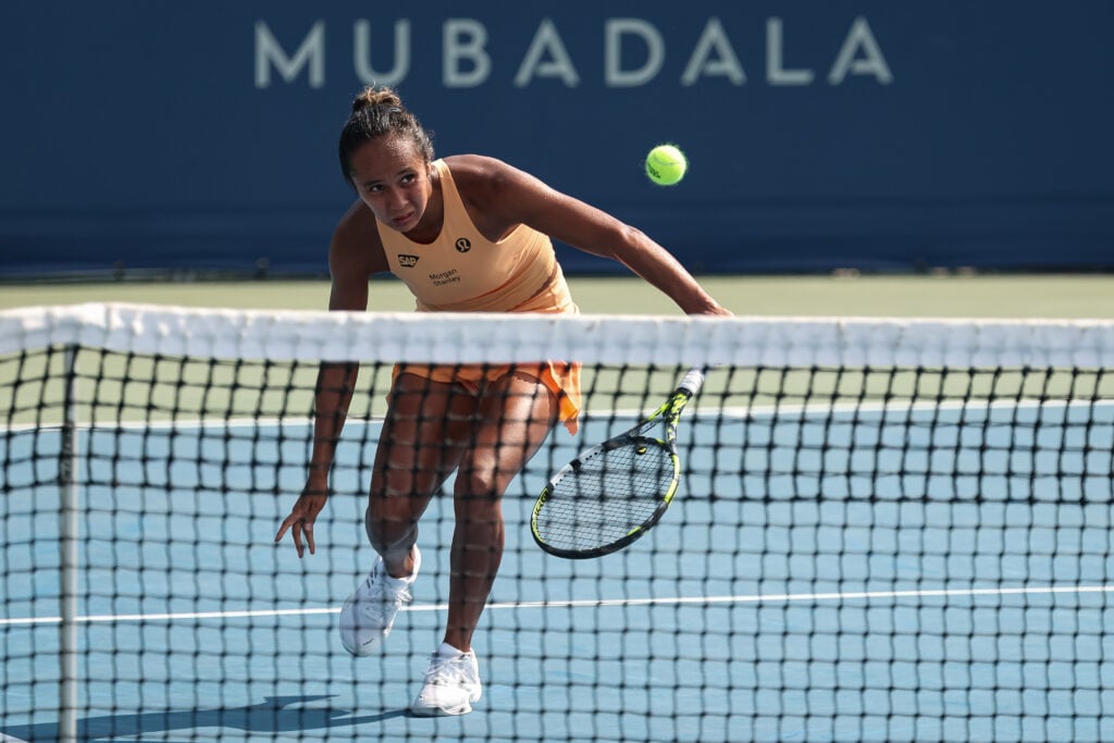 Leylah Fernandez plays a slice shot before approaching the net during a rally at the Mubadala Citi DC Open 2025