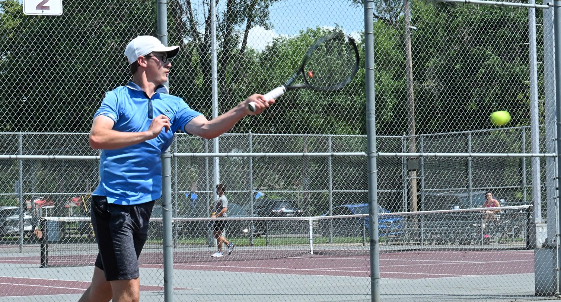 Aberdeen's Gannon May hits a forehand during his singles match in the Hub City Open tennis tournament Friday, July 25 at the Northern State courts. Aberdeen Insider photo by Robb Garofalo.