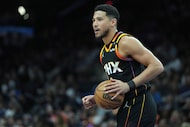 FILE - Phoenix Suns guard Devin Booker against the Oklahoma City Thunder during the first...