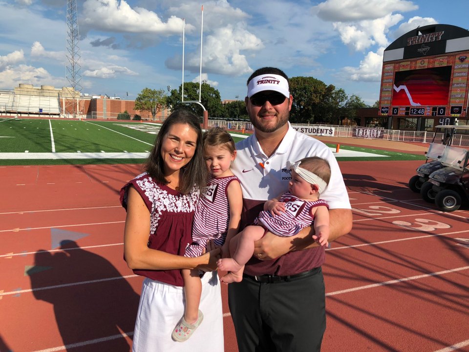 Family photo at a football stadium.