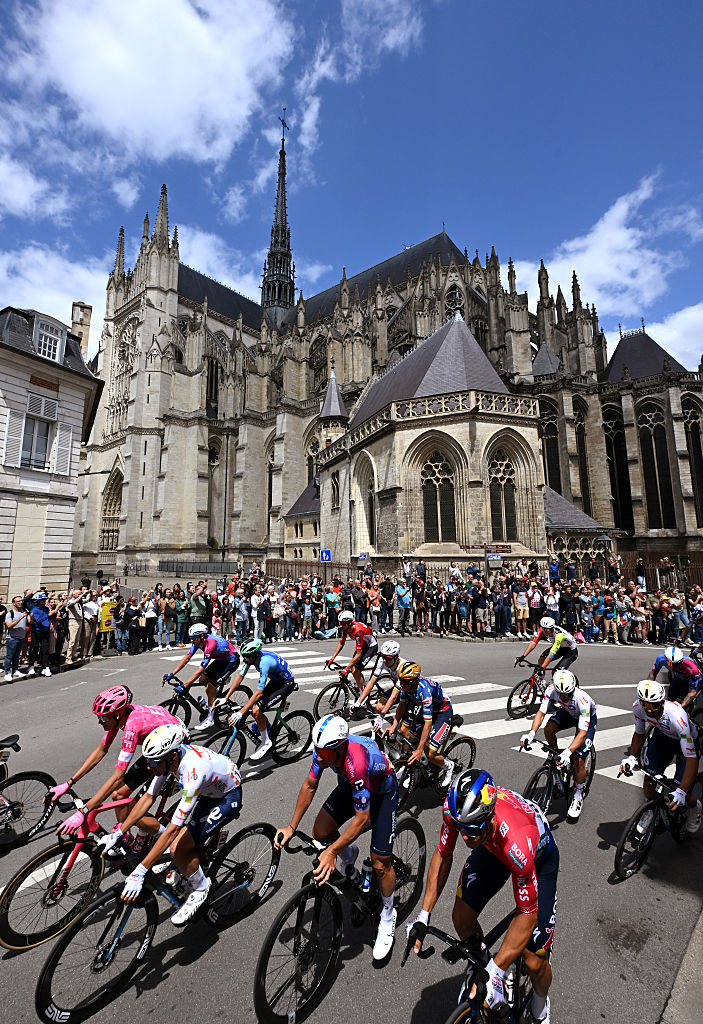 AMIENS, FRANCE - JULY 08: A general view of the peloton passing through a Amiens prior to the 112th Tour de France, Stage 4 a 174.2km stage from Amiens Metropole to Rouen / #UCIWT / on July 08, 2025 in Amiens, France. (Photo by Tim de Waele/Getty Images)