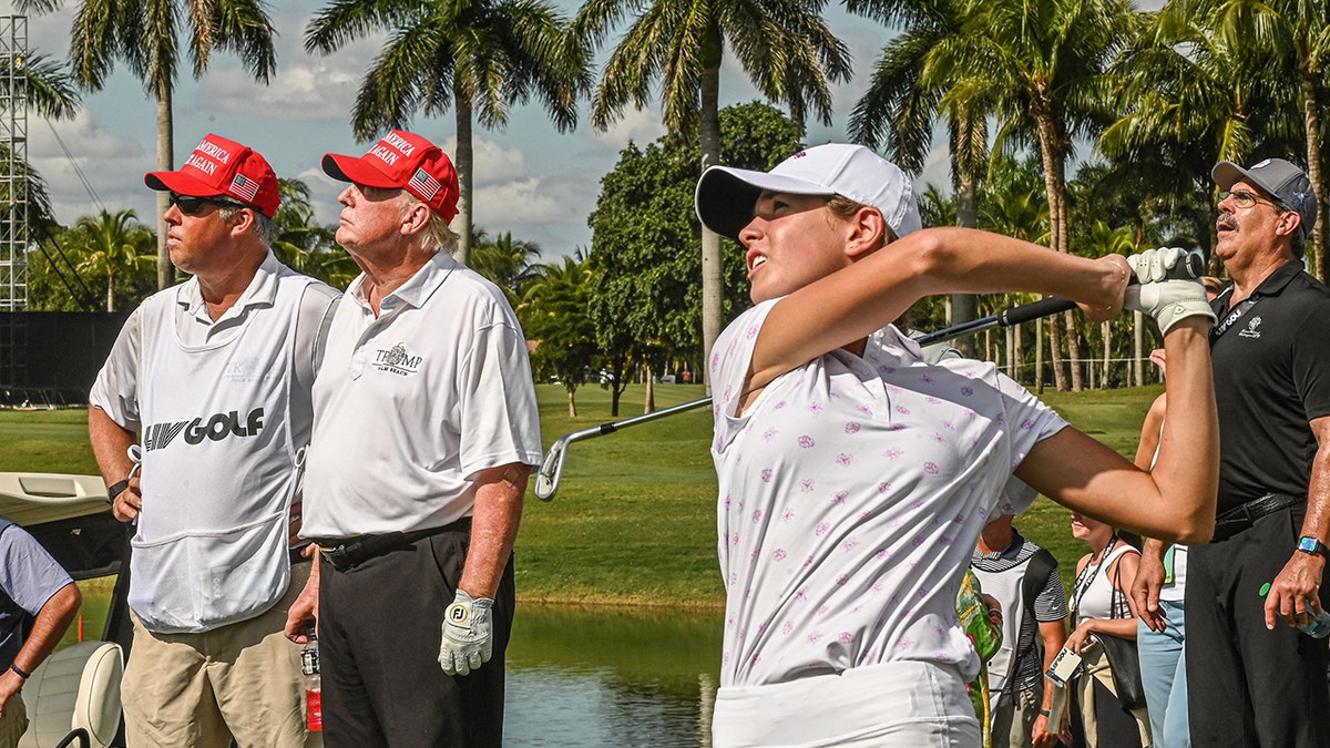 Kai Trump swings golf club