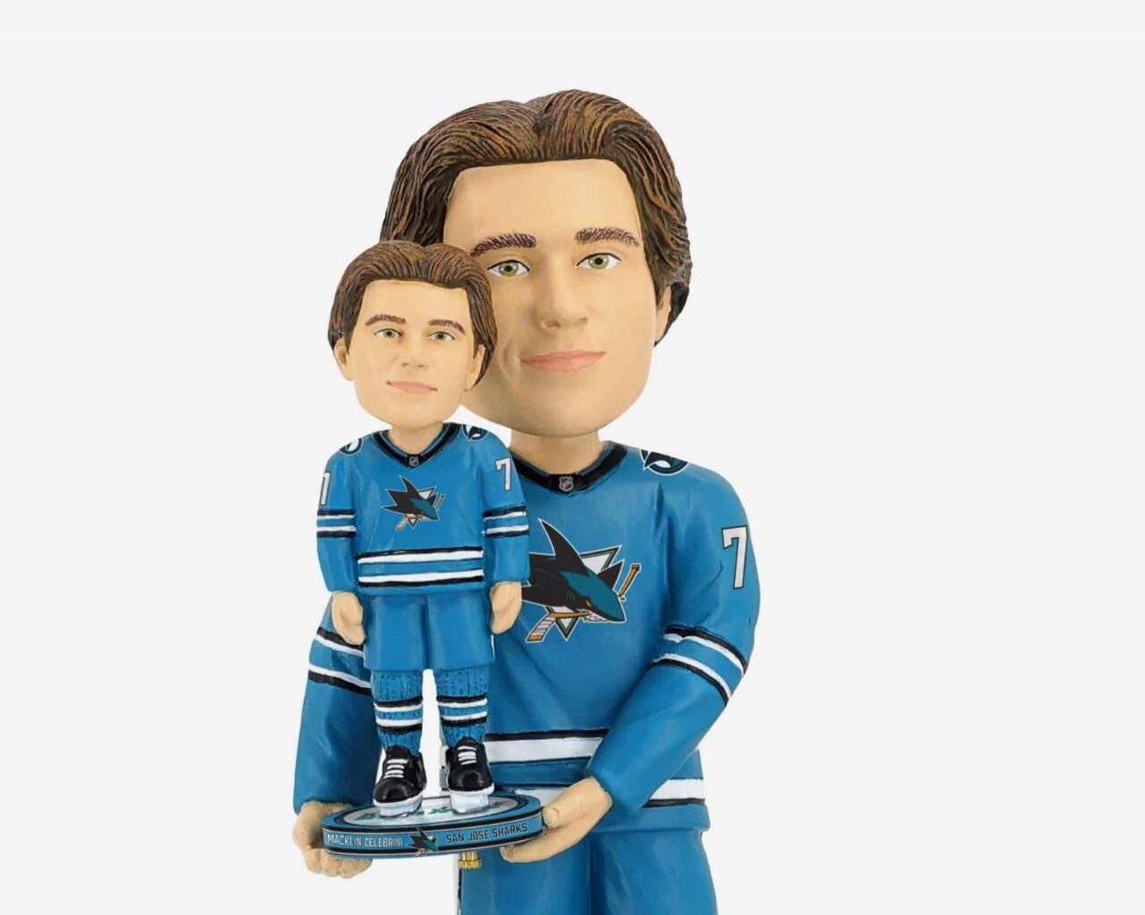 Why is he holding a trophy of himself?