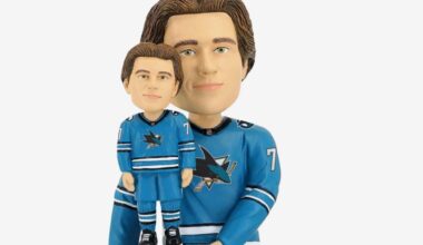 Why is he holding a trophy of himself?