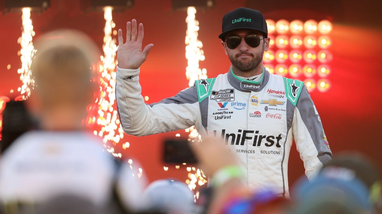 NASCAR Cup Series driver Chase Elliott (right) stands with his father and former driver Bill Elliott (left) prior to the AAA Drive for Autism at Dover International Speedway.