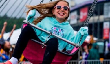 A young race fan enjoys a carnival ride in New Hampshire Motor Speedway’s Fan Zone on June 23, 2024.