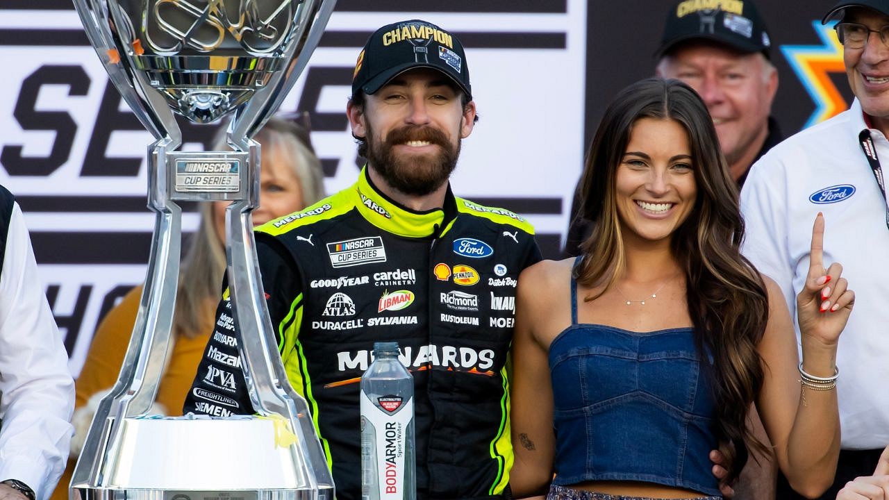 Nov 6, 2022; Avondale, Arizona, USA; NASCAR Cup Series driver Ryan Blaney (right) with girlfriend Gianna Tulio during the Cup Championship race at Phoenix Raceway. Mandatory Credit: Mark J. Rebilas-Imagn Images