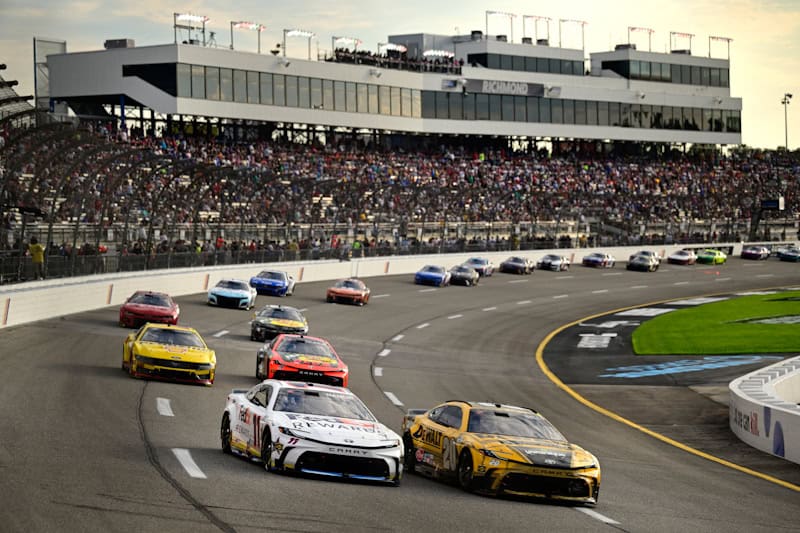 2024 Cup Richmond II pack racing VII - Joe Gibbs Racing teammates Denny Hamlin, No. 11 Toyota, and Christopher Bell, No. 20 Toyota (Credit: Logan Whitton/Getty Images via NASCAR Media)
