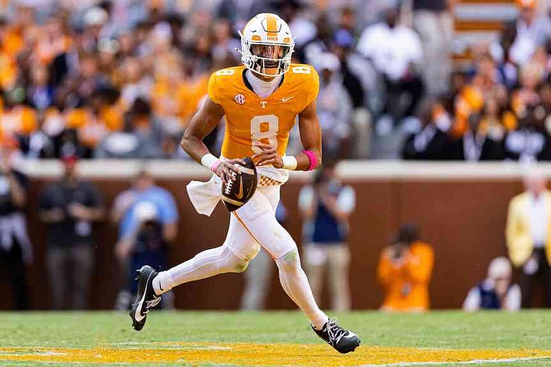 FILE - Tennessee quarterback Nico Iamaleava, who has since transferred to UCLA, rolls out to pass during the first half of an NCAA college football game against Alabama, Saturday, Oct. 19, 2024, in Knoxville, Tenn. (AP Photo/Wade Payne, File)