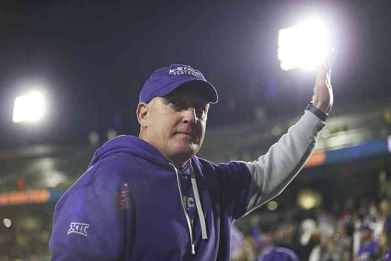 FILE - Kansas State head coach Chris Klieman waves after defeating West Virginia in an NCAA college football game on Oct. 19, 2024, in Morgantown, W.Va. (AP Photo/William Wotring, File)