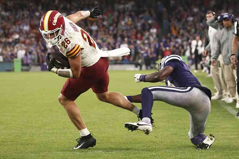 ADDS PLAY WAS OVERTURNED BY REVIEW - Iowa State Carson Hansen breaks a tackle on his way to the endzone that was ruled a touchdown and later overturned by review during an NCAA college football game between Iowa State and Kansas State in Dublin, Ireland Saturday, Aug. 23, 2025. (AP Photo/Peter Morrison)