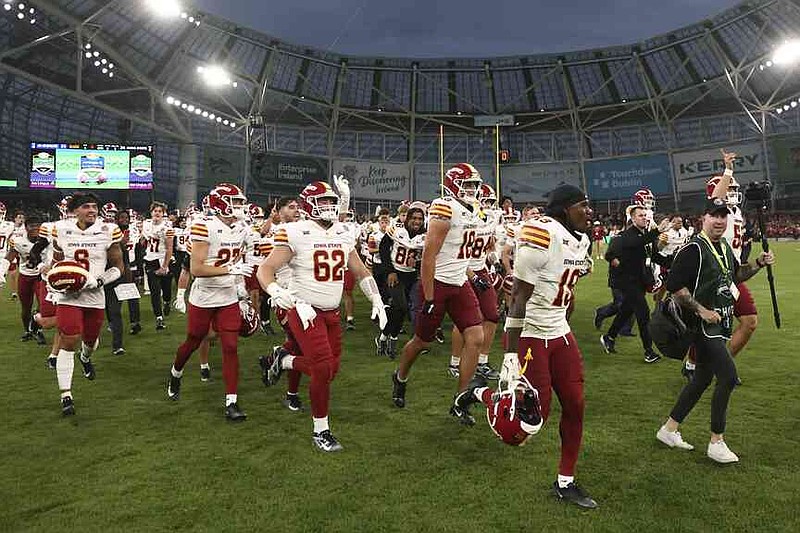Iowa State players celebrate after winning an NCAA college football game between Iowa State and Kansas State in Dublin, Ireland Saturday, Aug. 23, 2025. (AP Photo/Peter Morrison)