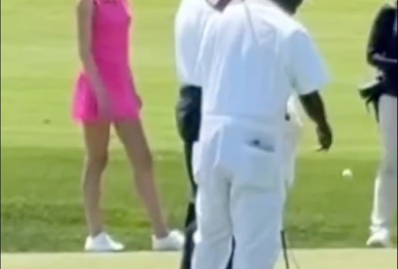 Caddie appears to throw the ball down for Trump.