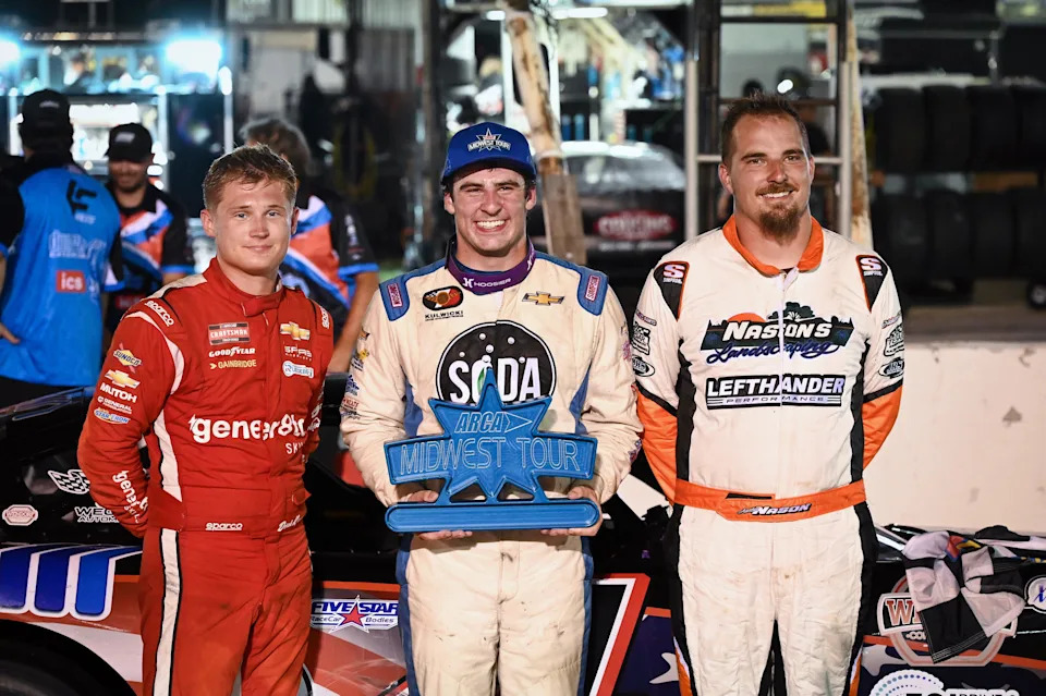 Luke Fenhaus is flanked by runner-up Austin Nason, right, and third-place finisher Derek Kraus after winning the ASA Midwest Tour Gandrud Auto Group 250 on Tuesday, August 5, 2025, at Wisconsin International Raceway in Kaukauna, Wisconsin.