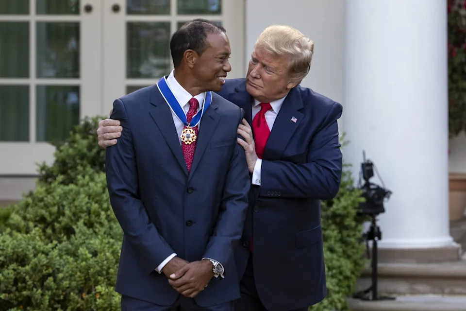 U.S. President Donald Trump embraces Tiger Woods, professional golfer and co-founder of the Tiger Woods Foundation, after presenting him with a Presidential Medal of Freedom award during a ceremony in the Rose Garden of the White House in Washington, D.C., U.S., on Monday, May 6, 2019. Trump announced his plans to bestow the nations highest civilian honor upon Woods after he won this years Masters Tournament, his first major title in more than a decade. Photographer: Alex Edelman/Bloomberg via Getty ImagesBloomberg&sol;Getty Images