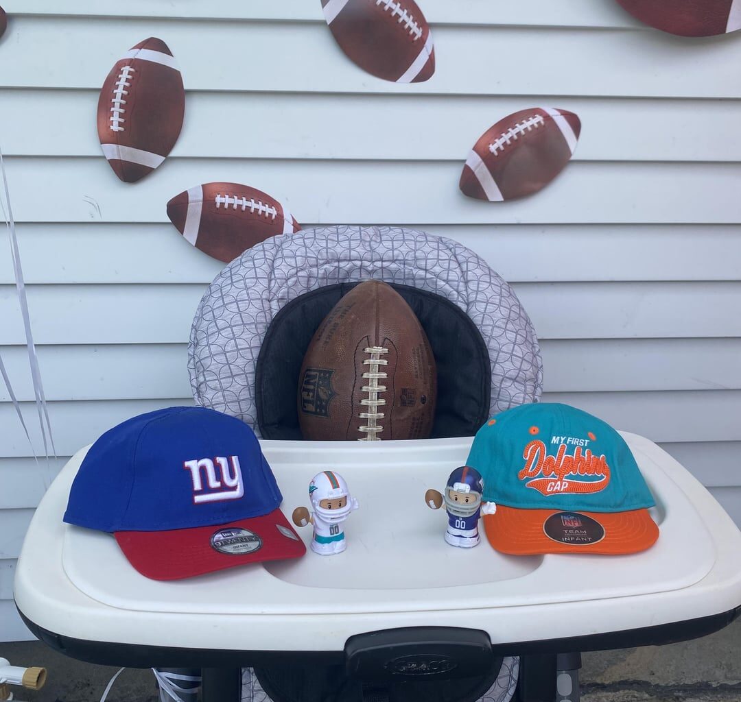 My wife is a Dolphins fan. My son turned 6months today, and that means he needed to pledge his allegiance to his team for life