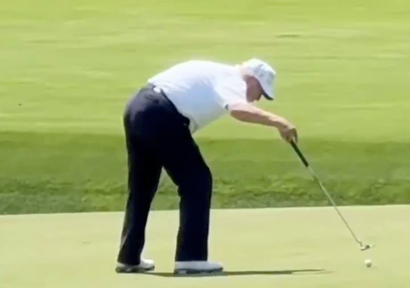 Trump drags the ball into the hole