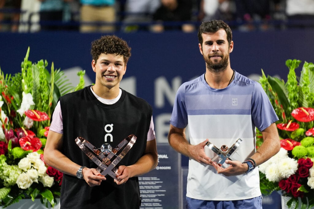 Ben Shelton and Karen Khachanov pose with their trophies after the Canadian Open final.