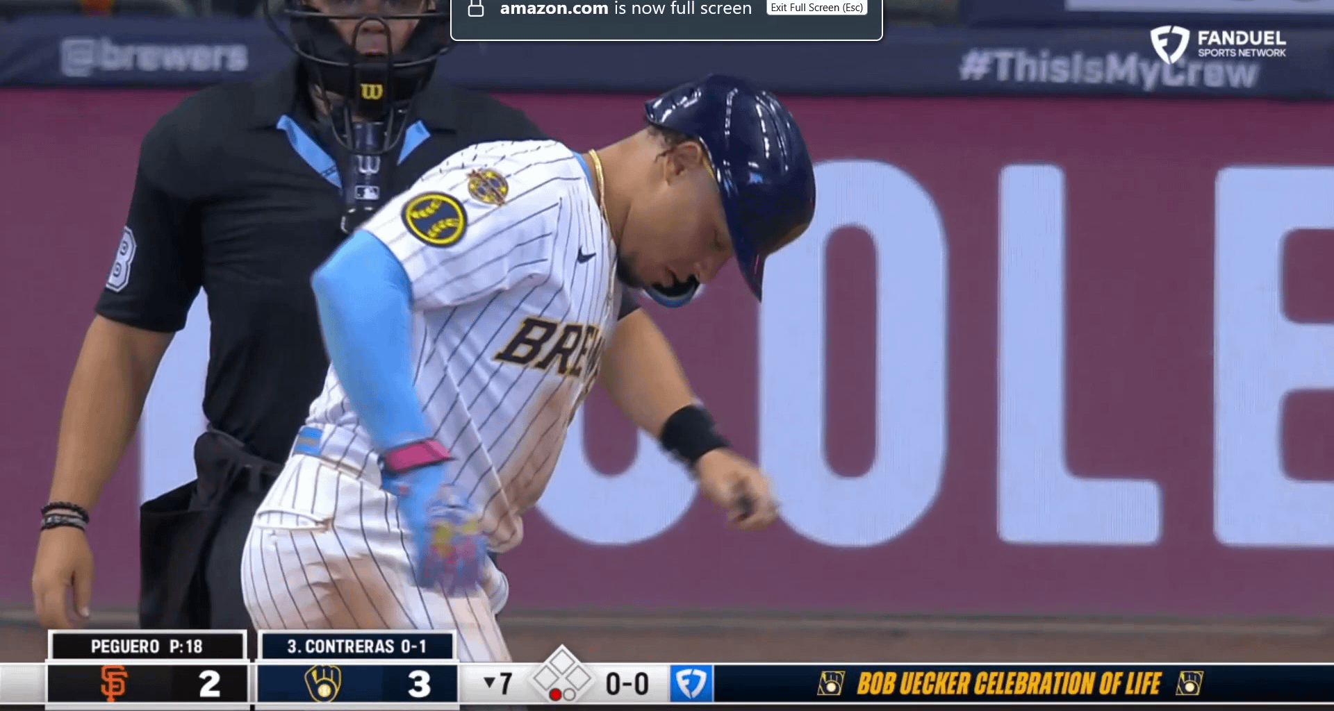 Rock and BA share a beer in the booth as the stadium toasts to Bob Uecker in the seventh