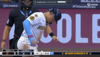 Rock and BA share a beer in the booth as the stadium toasts to Bob Uecker in the seventh