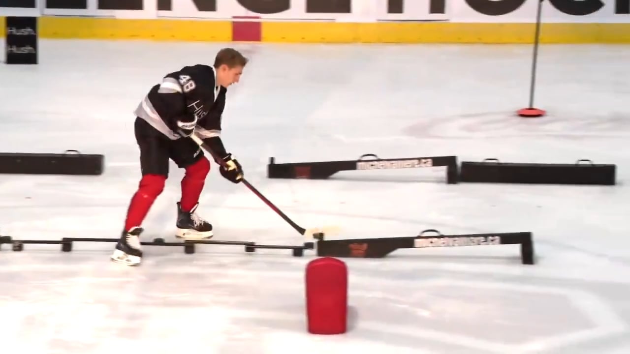 Lane Hutson cooking a drill during his charity event