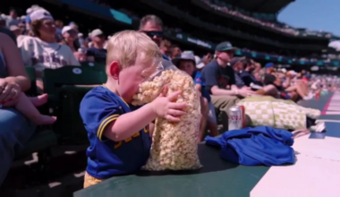 This child at the Mariners game achieving unimaginable bliss