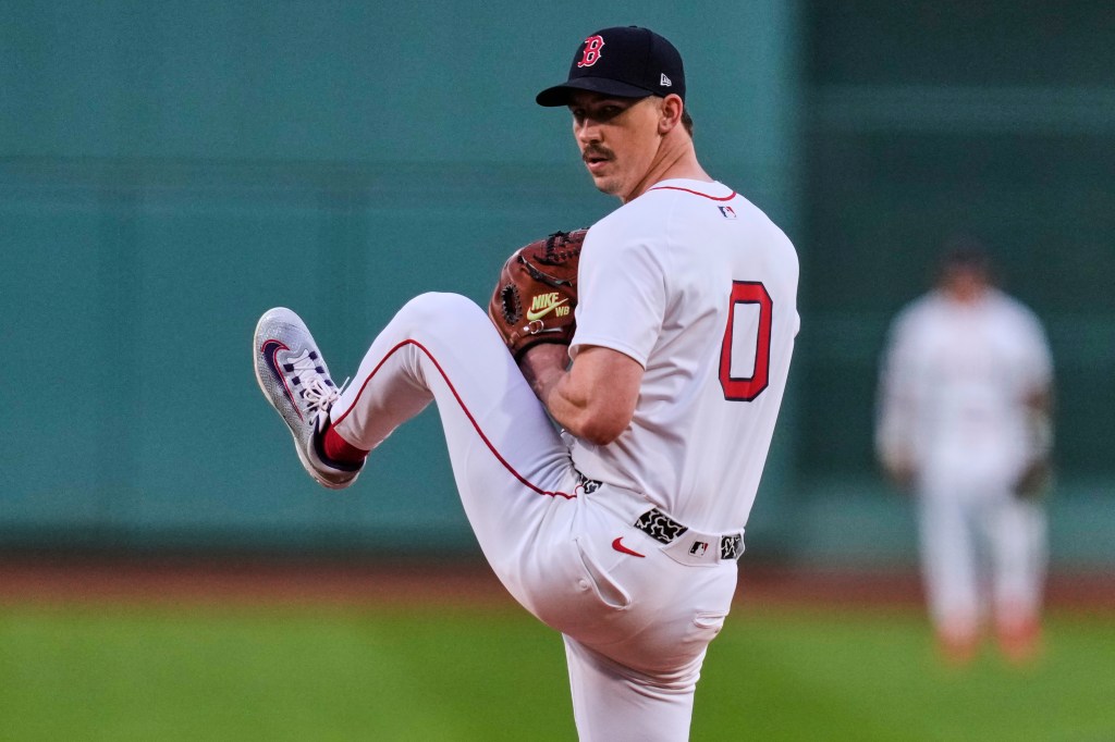 Boston Red Sox pitcher pitching a baseball.