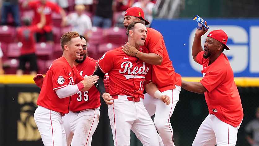 Reds notch win against first place Brewers, further lifting team's hopes of achieving sweep-free season