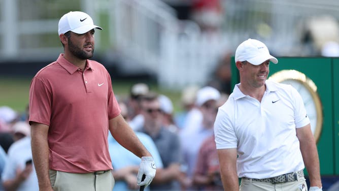 PGA Tour superstars Scottie Scheffler and Rory McIlroy look on from the ninth tee during the first round of the TOUR Championship 2025.