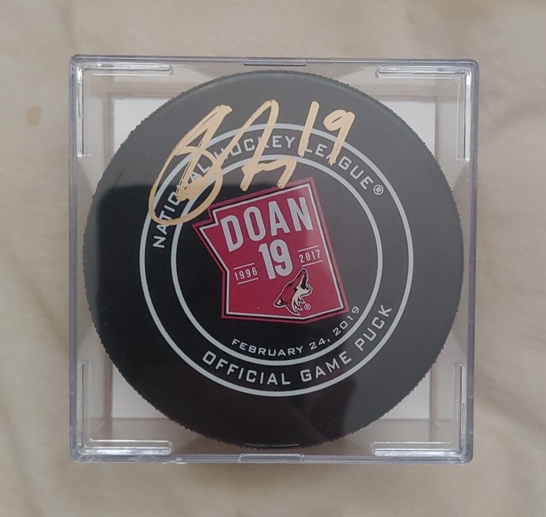 Signed Shane Doan game used retirement puck