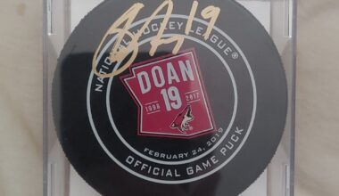Signed Shane Doan game used retirement puck